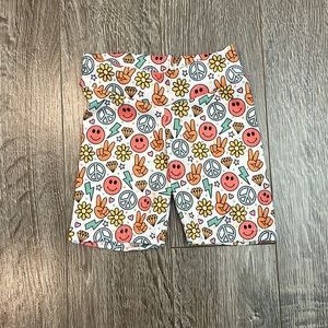 Smiley face, peace child biker shorts.